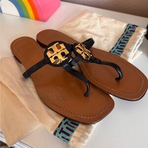 Tory Burch black flip flop with dust bag.